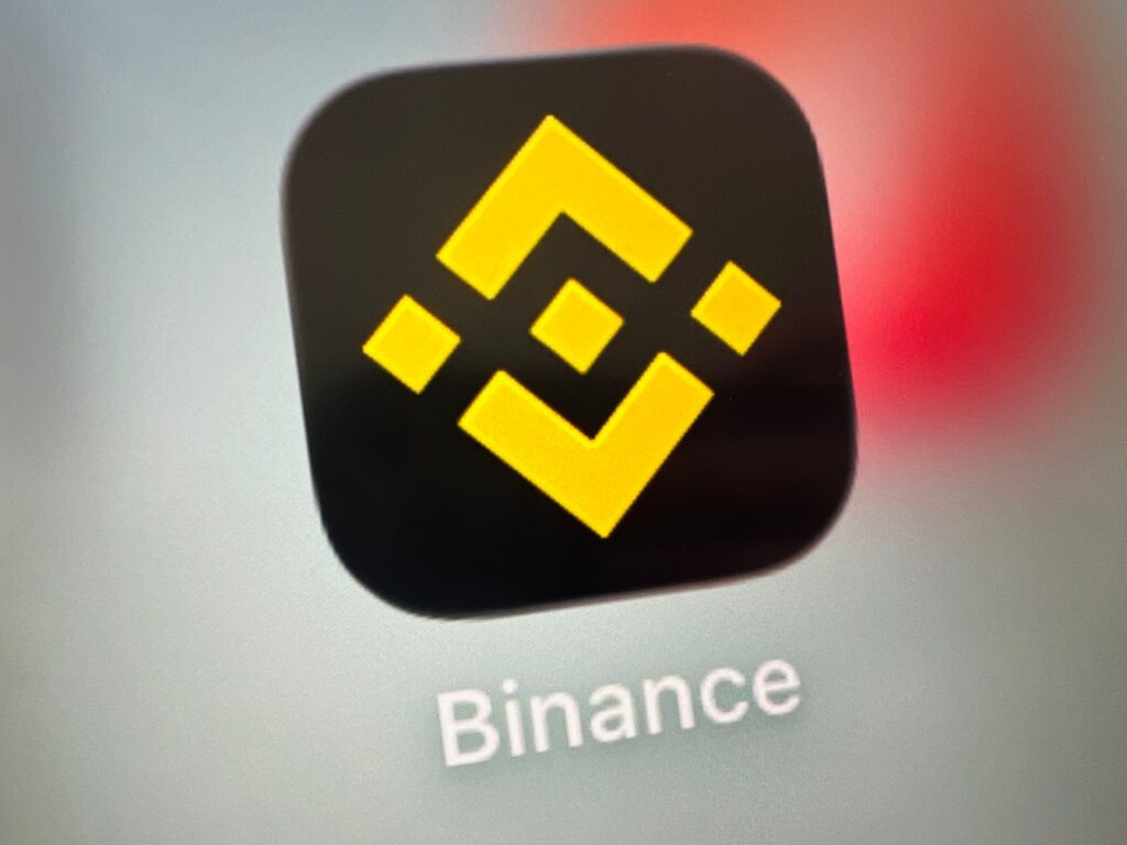 Binance mobile app icon: yellow Binance logo on a dark rounded-square background.